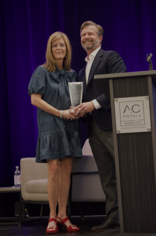 ULC CEO Brooks Rainwater gives Lisa Wells award ULC CEO Brooks Rainwater gives Lisa Wells award