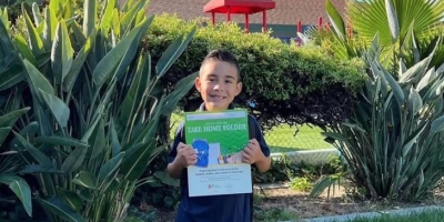 Students Holding Folder