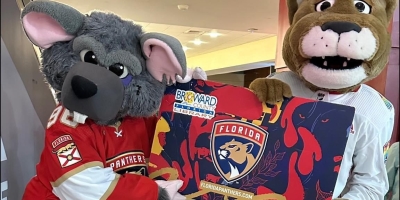 The Florida Panthers Mascots Holding Oversized Florida Panthers Broward County Library Card