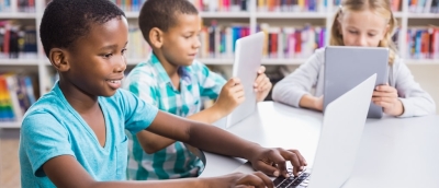 Kids Using Laptop And Digital